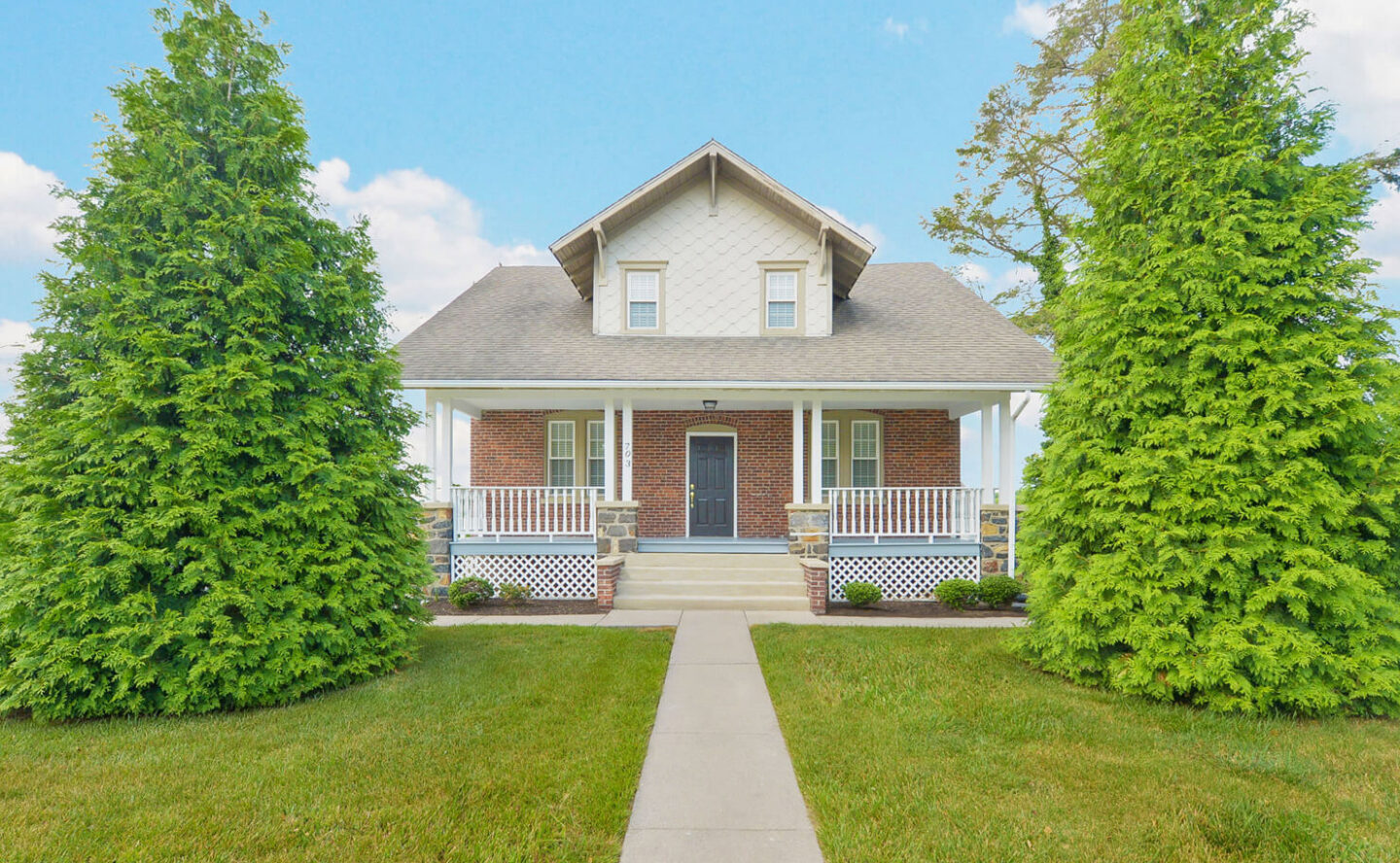 Modern kitchen with white cabinetry and stainless appliances