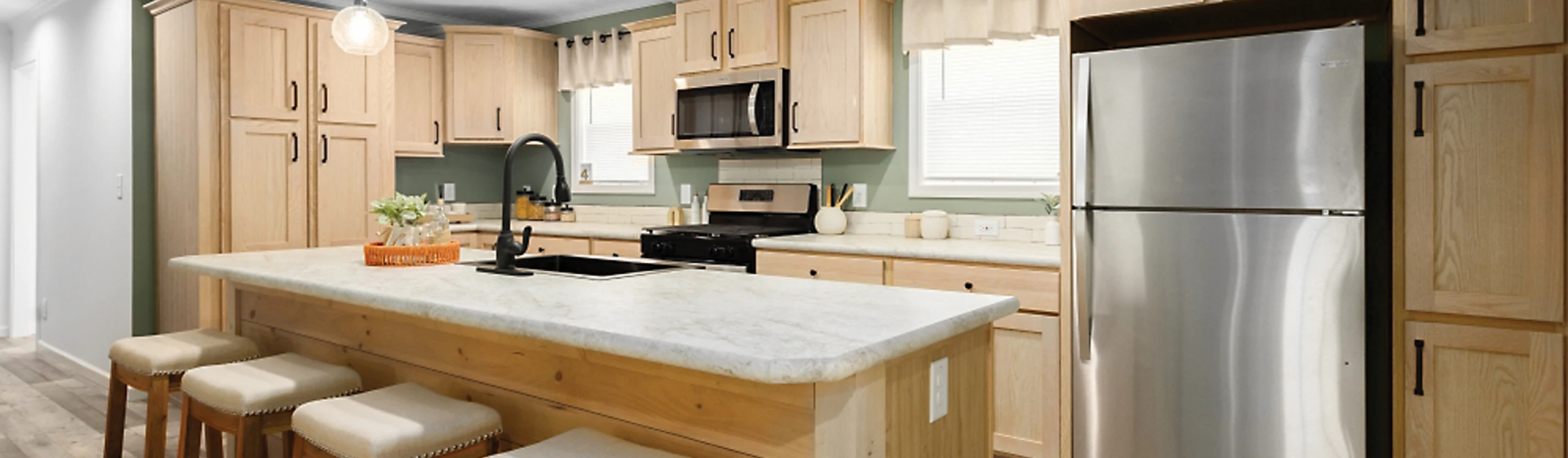 Customizable kitchen interior of Reybold Manufactured Home in Delaware with stainless steel appliances