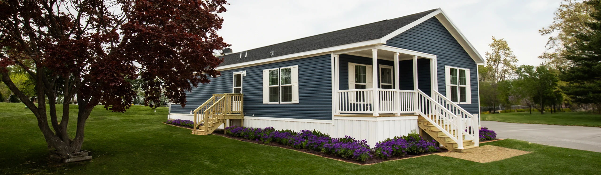 Charming Blue Reybold Manufactured Home model in Delaware displaying customizable exterior finishes
