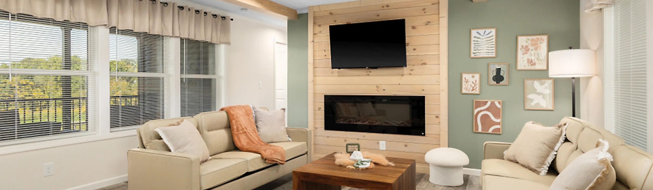 Cozy living area of Reybold Manufactured Home in Delaware with plush seating and natural light