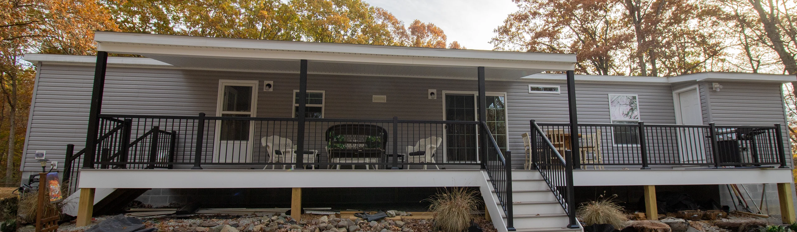 Covered front porch of Reybold Manufactured Home in Delaware with outdoor seating