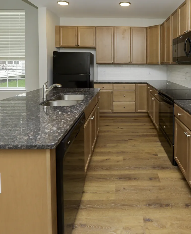 gallery-10@2x Kitchens at Meridian Crossing are appointed with high-end finishes and appliances, including easy-to-clean surfaces